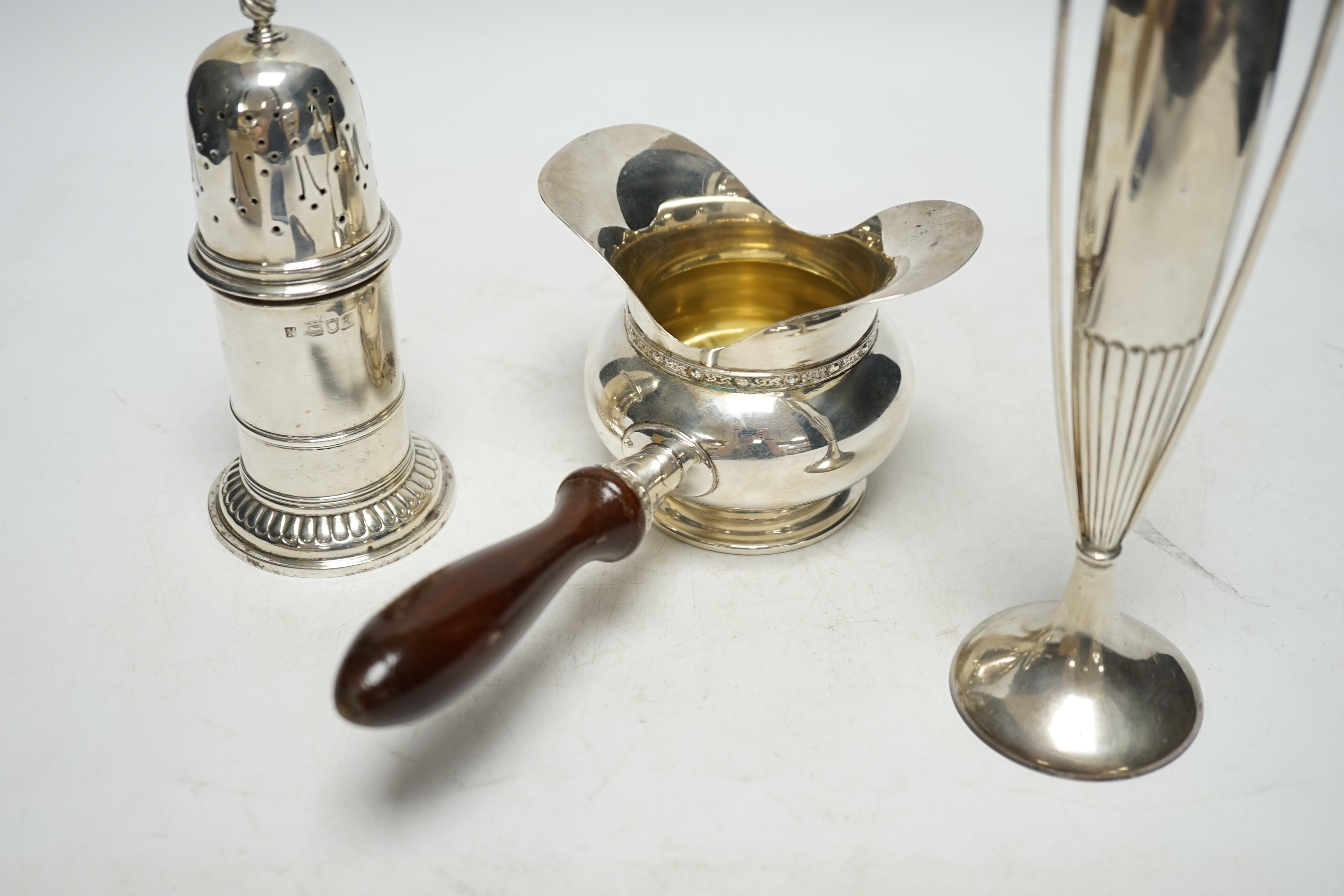 An Art Nouveau silver two handled posy vase, Birmingham, 1912, 19.9cm, a Victorian silver sugar caster and a modern silver double lipped pan. Condition - fair